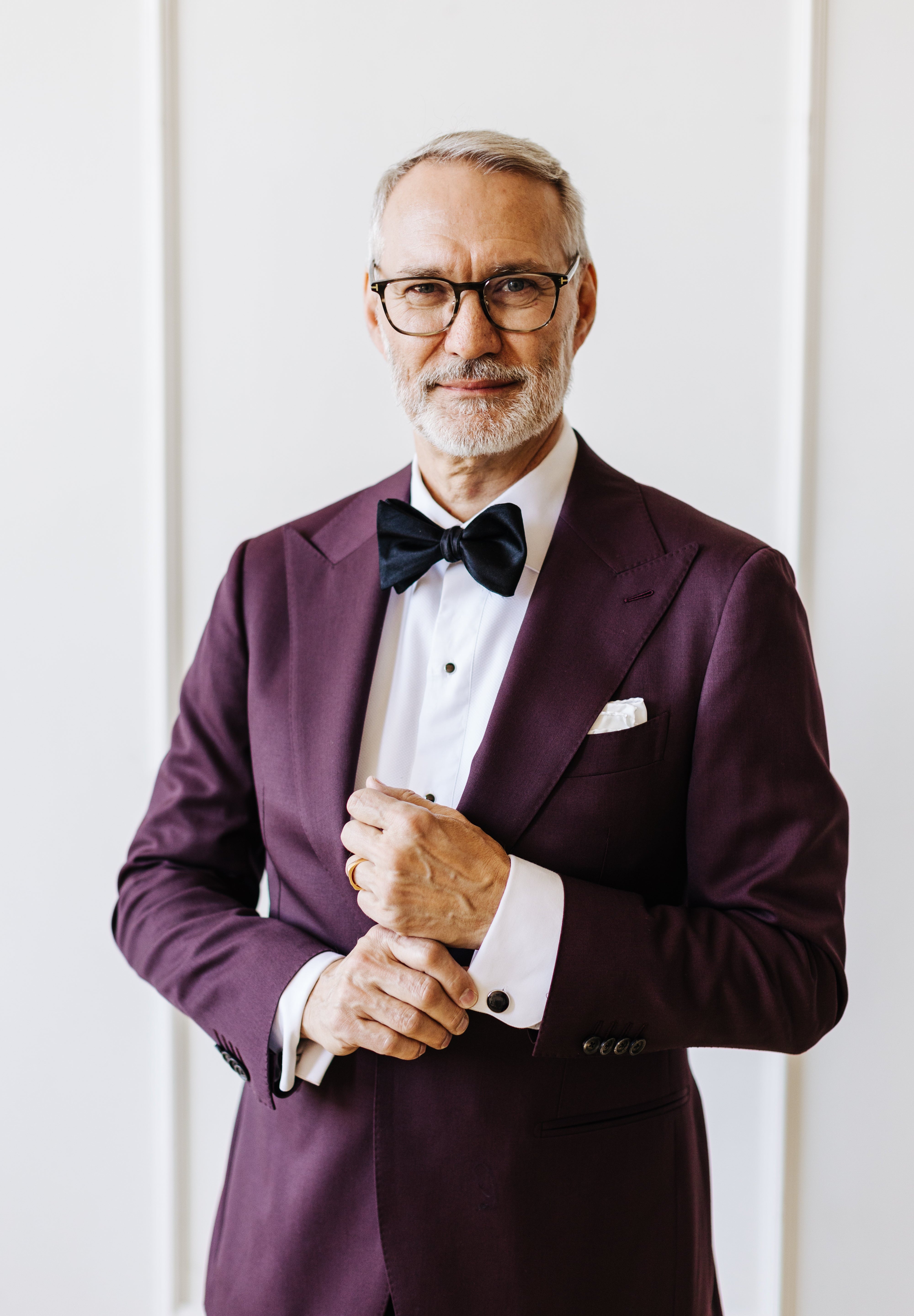 green double breasted tuxedo and black bow tie